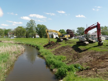 Two Backhoes Working